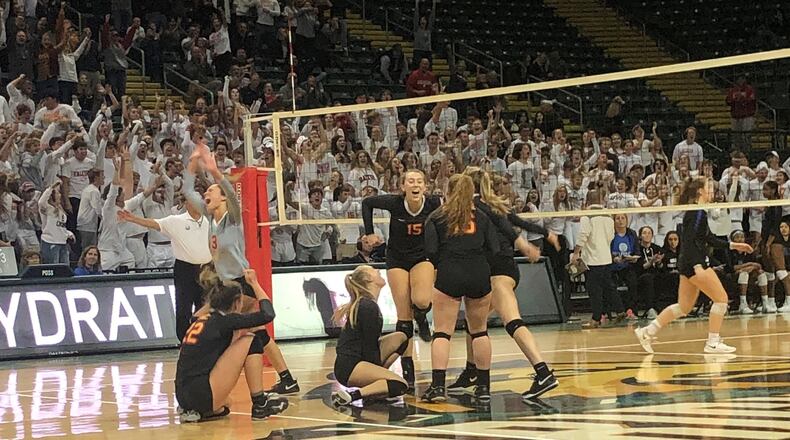 The Fenwick High School girls volleyball team celebrates its five-set win over Gilmour Academy in the Division II state semifinals Thursday at Wright State’s Nutter Center. Debbie Juniewicz/CONTRIBUTED