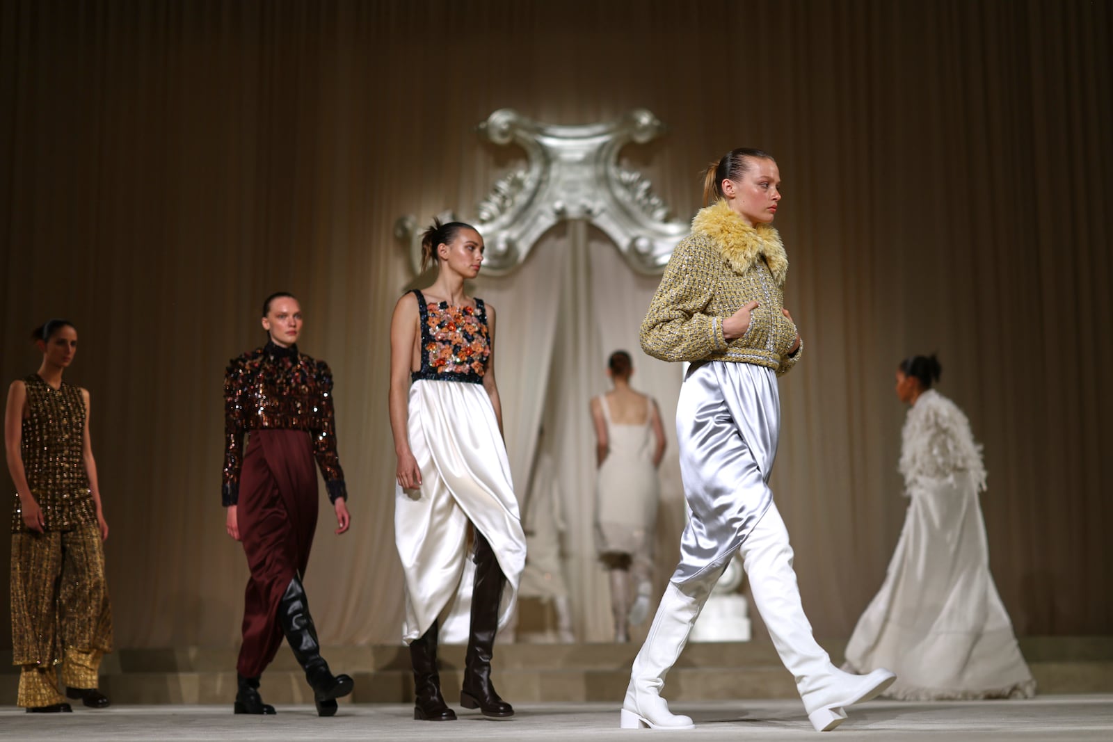 Models wear creations as part of the Chanel Fall-Winter 2025/26 Haute Couture collection presented Tuesday, July 8, 2025, in Paris. (AP Photo/Tom Nicholson)