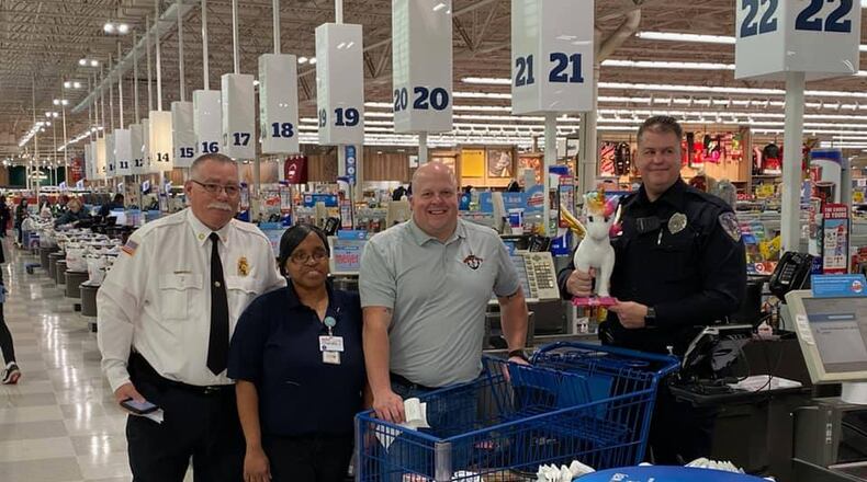 Fairfield Twp. fire and police officials, along with other hometown heroes around Fairfield Twp. and the city of Fairfield, shopped for dozens of children around the two communities for Dougie & Ray's annual Shop with a Hero program. PROVIDED