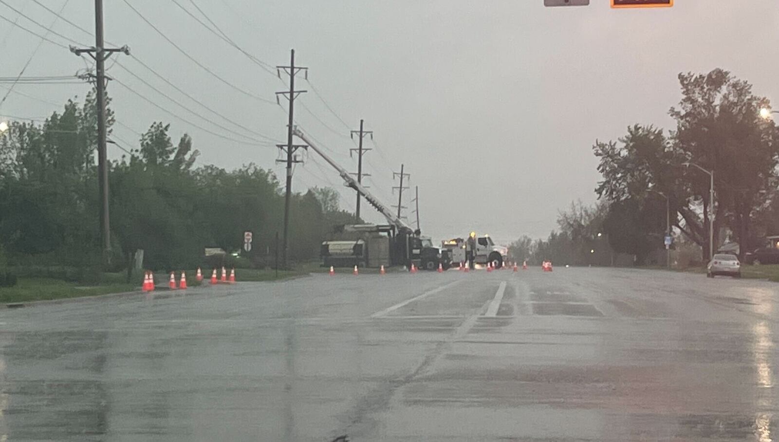 A crew works to repair damaged power poles during the severe thunderstorms Tuesday, April 29, 2025. SARAH CAVENDER, STAFF