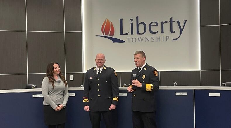The latest symbol of Liberty Twp.’s maturation as one of the region’s fastest growing communities was recently pinned onto the chest of Fire Department Lt. Matthew Owen. Late last month, Owen took part in a ceremony during a Liberty Twp. Trustees’ meeting where he was announced as the township’s first fire marshal. Owen was joined by his wife Kelly as Liberty Twp. Fire Chief Ethan Klussman (right) conducted the pinning ceremony. (Provided Photo\Journal-News)