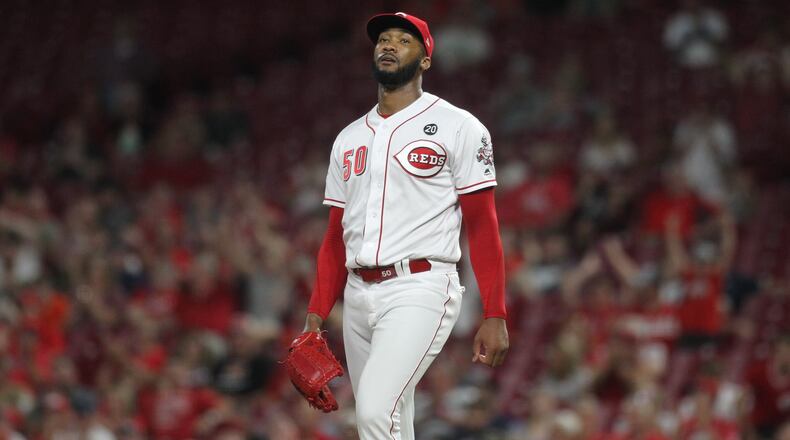 Reds reliever Amir Garrett reacts after striking out the side against the Brewers on Tuesday, July 2, 2019, at Great American Ball Park in Cincinnati.