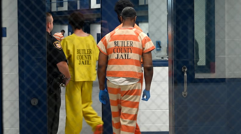 Butler County Sheriff Richard Jones has taken a hard stance on immigration since taking office more than two decades ago. He had 10 deputies credentialed to serve as ICE agents in the county, and said he plans to have more deputies eventually go through the training. Pictured are inmates on Wednesday, July 9, 2025, entering a pod to assist in cleaning. MICHAEL D. PITMAN/STAFF