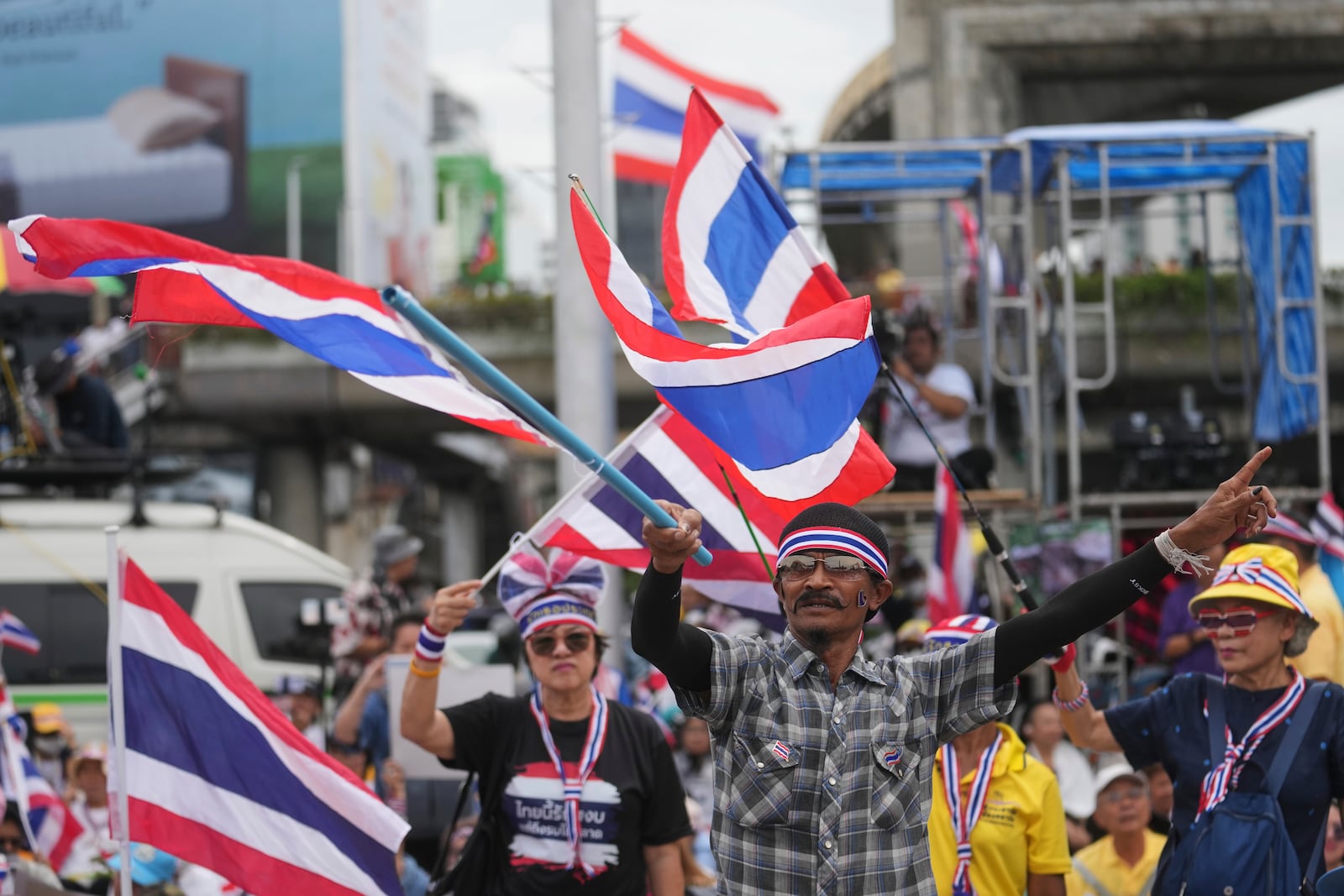 Protesters gather at Victory Monument demanding Thailand's Prime Minister Paetongtarn Shinawatra resign in Bangkok, Thailand, Saturday, June 28, 2025. (AP Photo/Sakchai Lalit)
