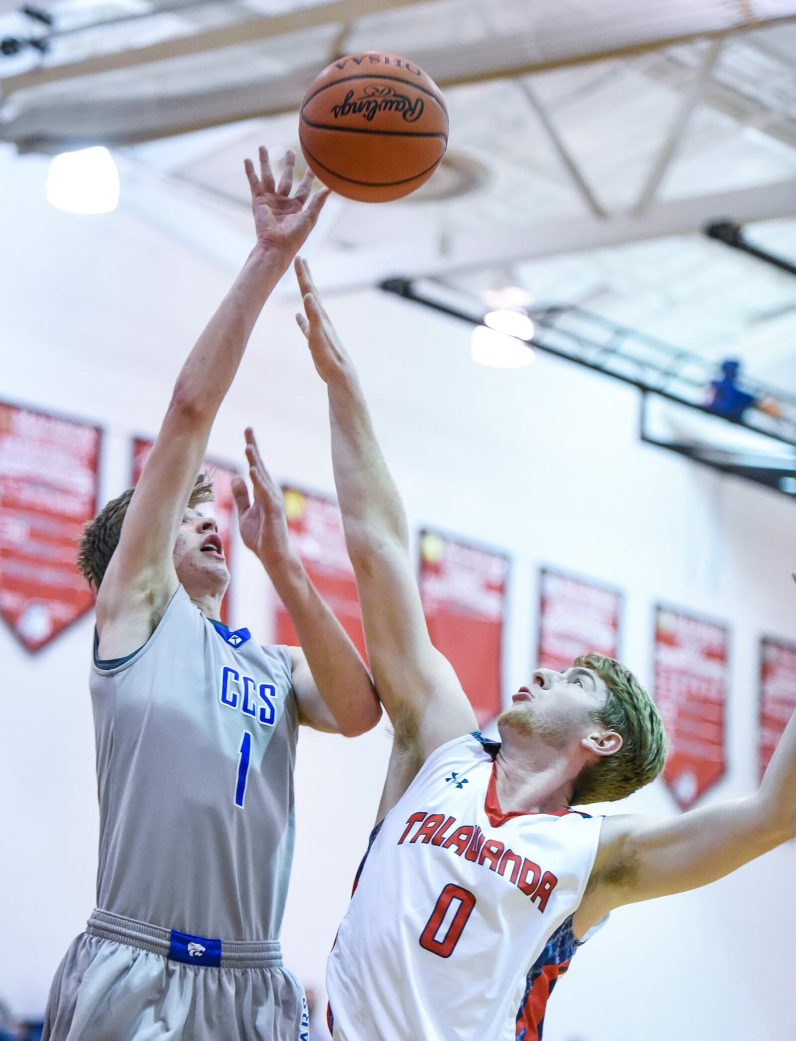 Cincinnati Christian’s Riley Reutener puts up a shot over Talawanda’s Evan James during Thursday night’s Brian Cook Classic in Madison Township. NICK GRAHAM/STAFF