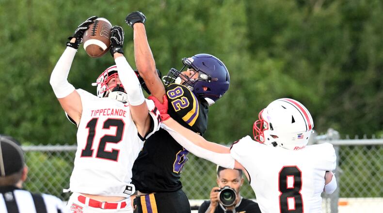 Tippecanoe High School senior Max Deckard (12) and senior Jackson Robbins (8) defend a pass against Bellbrook's Noah Barrios during their game on Friday, Aug. 22 at Miami Valley South Stadium. Tippecanoe won 21-0. NICK FALZERANO / CONTRIBUTED PHOTO