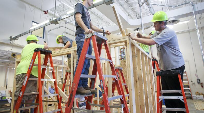 Students in the Hamilton High School Career Tech Ed program work on building a shed for one of the district’s elementary schools in 2013. Hamilton’s career education will merge at the end of the 2018-2019 school year with the much larger Butler Tech schools. GREG LYNCH/2013