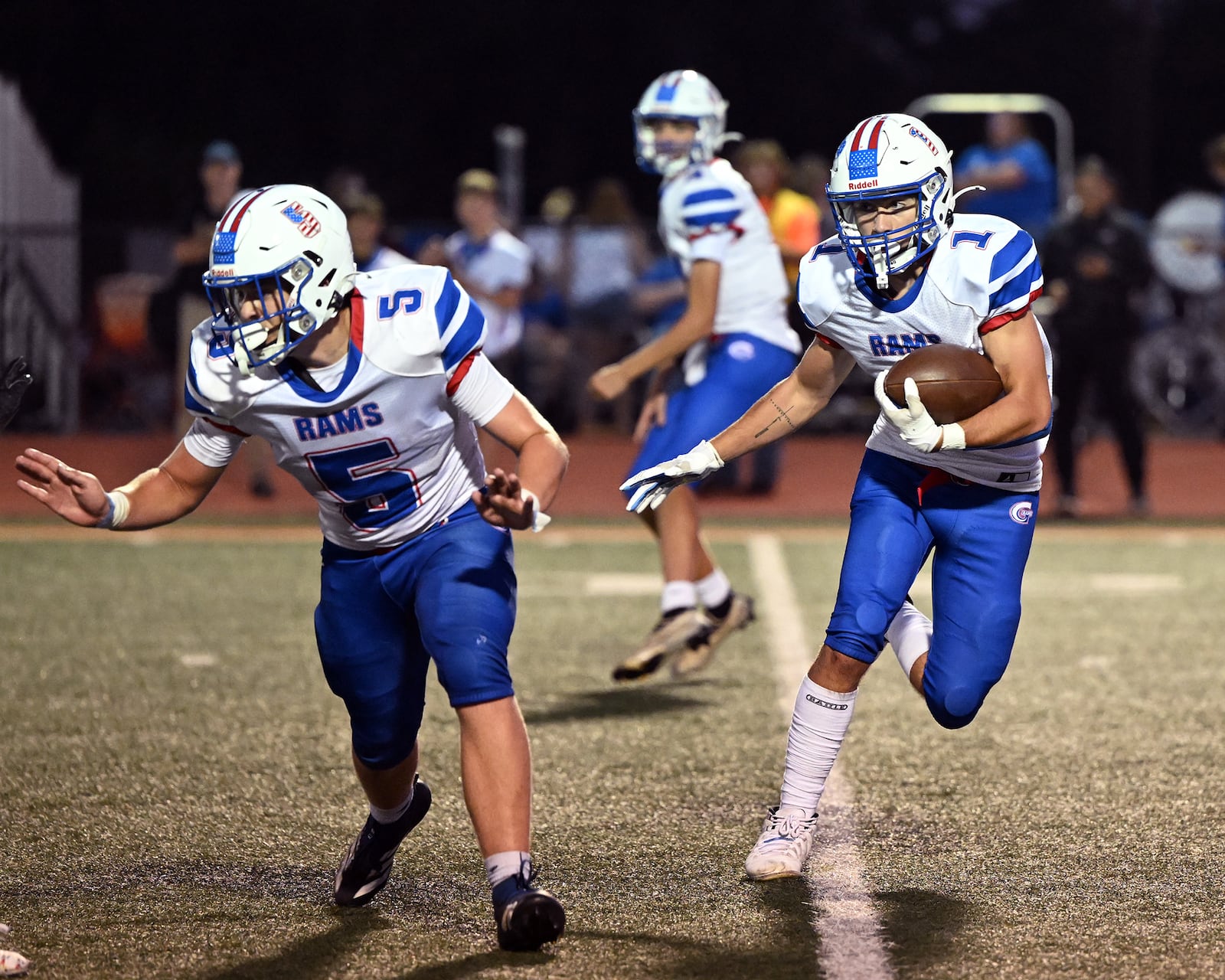 Greeneview's Jordan Stafford runs the ball as Rhett Hickman blocks for him during their game against Waynesville on Friday, Aug. 29 at Spartan Field. The Spartans won 21-0. NICK FALZERANO/CONTRIBUTED