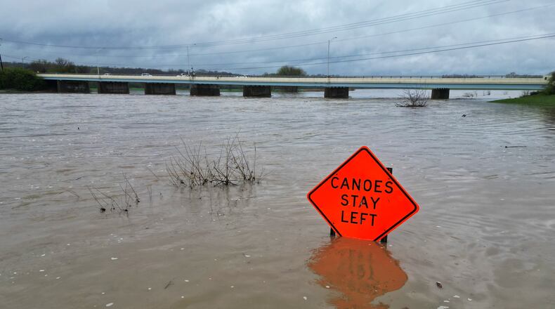 The level of the Great Miami River is up after several days of heavy rain Saturday, April 5, 2025 near the Ohio 122 bridge in Middletown. NICK GRAHAM/STAFF