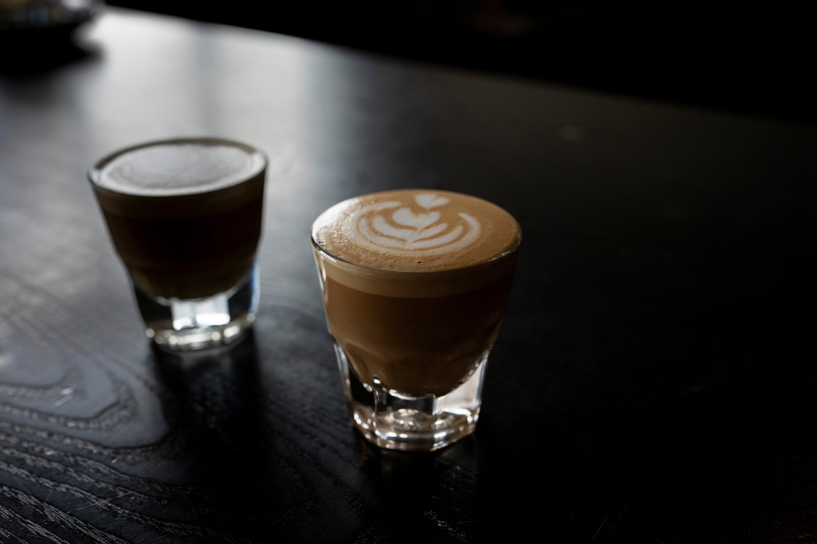 A couple of espresso drinks sit on a counter at Fuego Coffee Roasters, Saturday, March 22, 2025, in Rochester, N.Y. (Max Conway via AP)