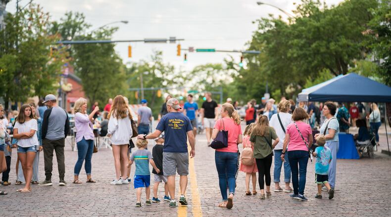 People are seen on High Street in oxford during a 2023 Red Brick Friday event. CONTRIBUTED/CITY OF OXFORD