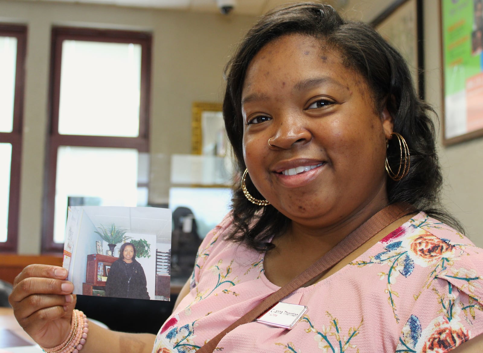 Cyanna Thornton holds a picture of herself taken while she was a student at the Dayton Job Corps Center on Gettysburg Avenue.