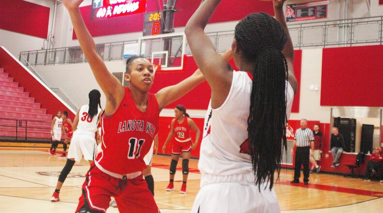 Lakota West’s Dominique Camp (11) defends an inbounds pass from Fairfield’s Zaria Black (2) on Dec. 1, 2018, at the Fairfield Arena. Fairfield won 53-48. RICK CASSANO/STAFF
