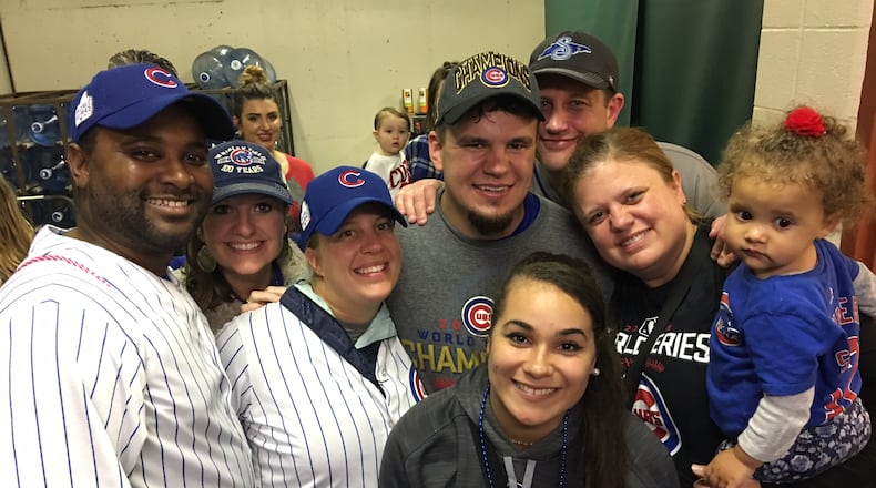 Friends and family surround Middletown native and Chicago Cubs star Kyle Schwarber shortly after the team won Game 7 of the World Series this week. CONTRIBUTED.