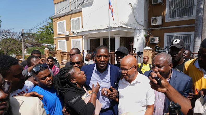 Former deputy Abel Decollines leaves after registering his political party, CAHDOA (Collective of Actors for Development and Alternative Organization), at the Provisional Electoral Council in the Petion-Ville neighborhood of Port-au-Prince, Haiti, Thursday, March 12, 2026. (AP Photo/Odelyn Joseph)