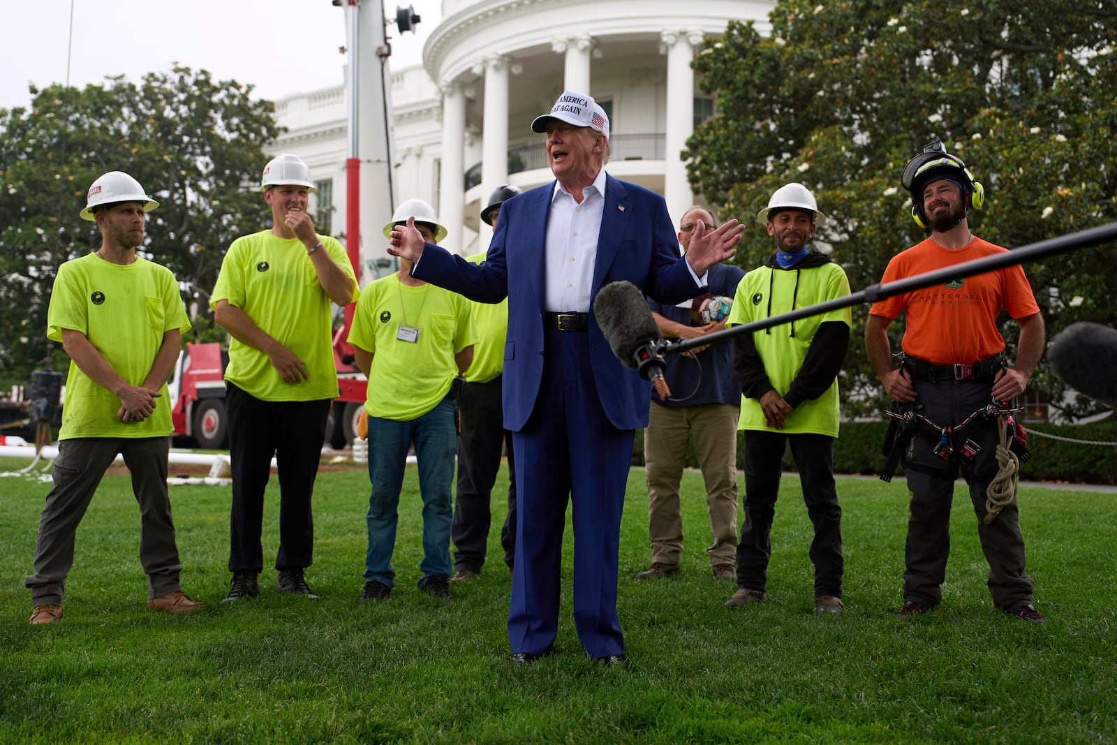 President Donald Trump speaks with reporters before a flag pole is installed on the South Lawn of the White House, Wednesday, June 18, 2025, in Washington. (AP Photo/Evan Vucci)
