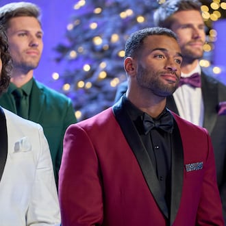 Men competing on "Finding Mr. Christmas" Season 2 team up to launch gifts into Santa’s sleigh, then soar sky-high as reindeer in an Entertainment Weekly photo shoot, where the winning team’s advantage shakes up the competition. HALLMARK/CONTRIBUTED