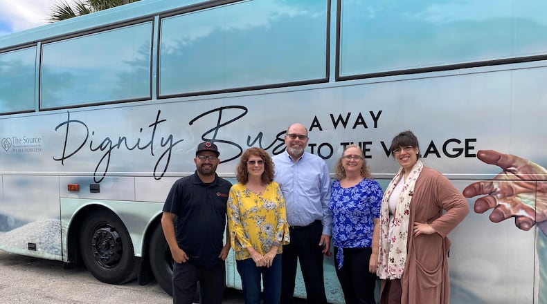A group of officials from Butler County traveled to Vero Beach, Fla. recently to tour a Dignity Bus that houses the homeless and provides support services. Pictured here from left to right: Tony Zorbaugh, executive director of The Source; Cindy Carpenter, Butler County Commissioner; Jeffrey Diver, executive director of SELF; Gayle Drexler, program director at SELF; and Elizabeth Slamka, Middletown community volunteer.