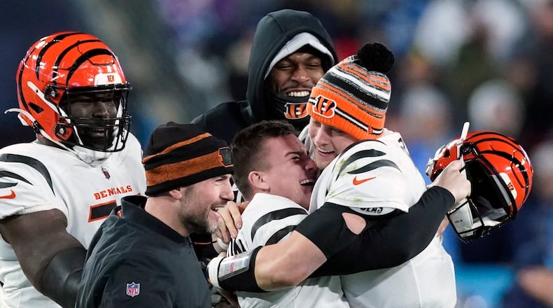 Cincinnati Bengals kicker Evan McPherson (2) celebrates his game-winning field goal against the Tennessee Titans with Cincinnati Bengals quarterback Joe Burrow (9) after an NFL divisional round playoff football game, Saturday, Jan. 22, 2022, in Nashville, Tenn. The Cincinnati Bengals won 19-16.(AP Photo/Mark Humphrey)