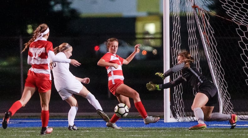 Lakota East’s Sophia Amaya (20) scores in overtime on Fairfield goalkeeper Jordan Shotwell during their Division I sectional girls soccer final Tuesday night at Hamilton’s Virgil Schwarm Stadium. East won 2-1. NICK GRAHAM/STAFF