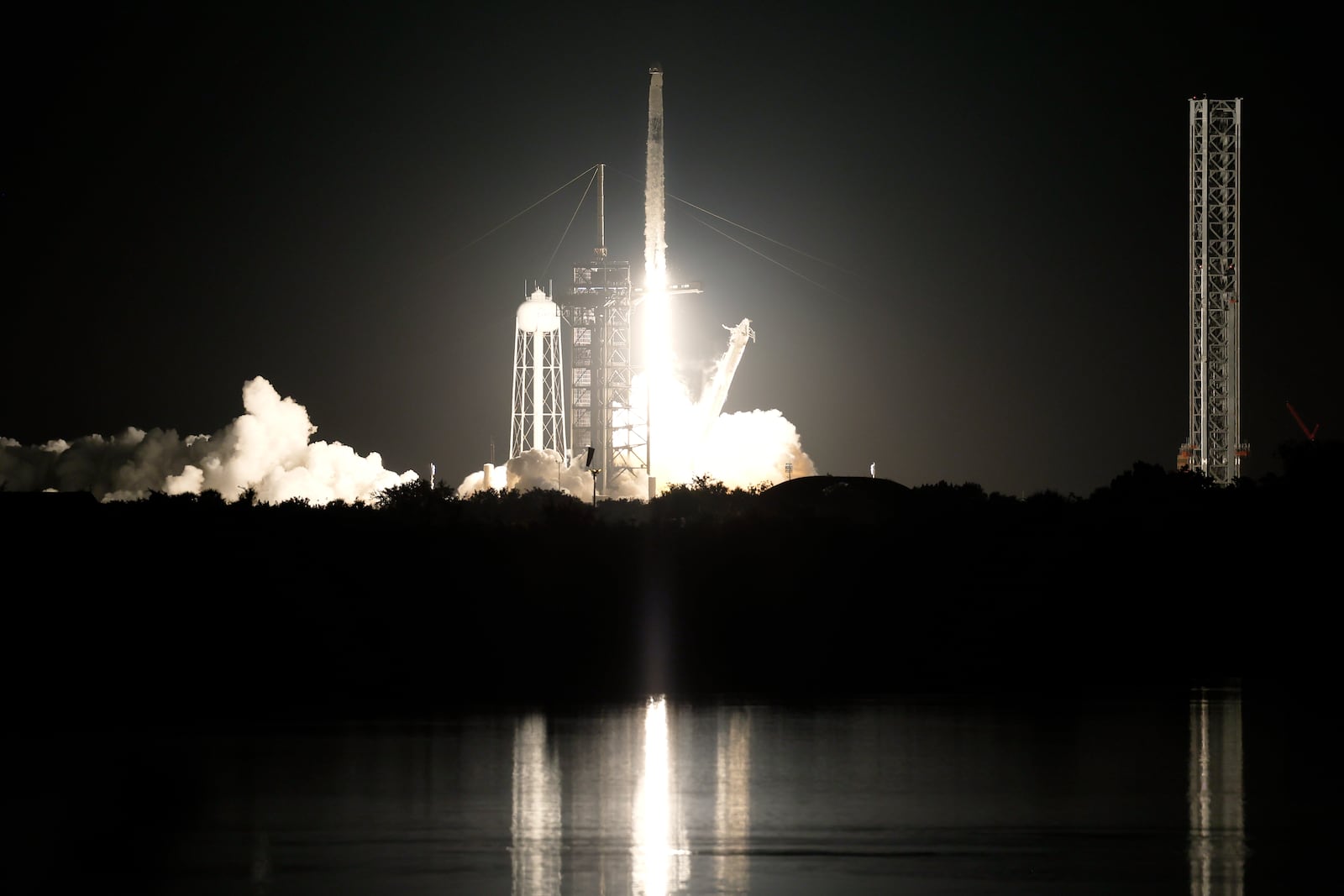 A SpaceX Falcon 9 rocket with a crew of four aboard a Dragon Spacecraft lifts off from pad 39A at the Kennedy Space Center in Cape Canaveral, Fla., Wednesday, June 25, 2025. (AP Photo/Terry Renna)