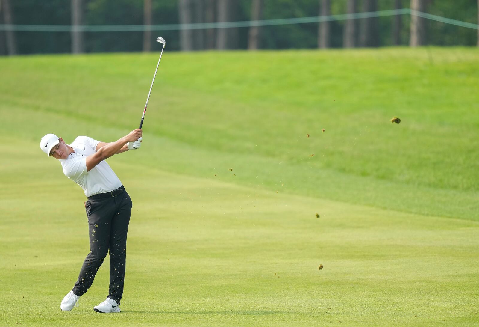 Cameron Champ hits his approach shot from the 18th fairway during the first round of the Canadian Open golf tournament in Caledon, Ontario, Thursday, June 5, 2025. (Nathan Denette/The Canadian Press via AP)