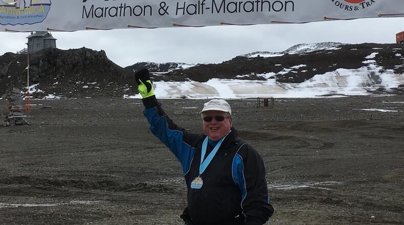 Frank Williams, then 70, stands at the finish line of his Antarctica race. CONTRIBUTED