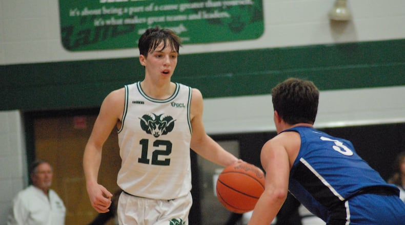 Badin's Alex Ritzie (12) is guarded by Springboro's Jaden Brown (3) night at Mulcahey Gym on Jan. 17, 2023. Chris Vogt/CONTRIBUTED