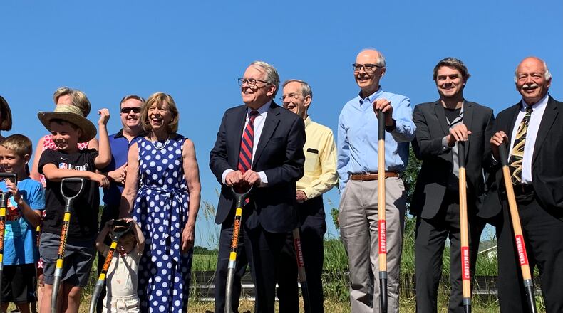 State officials, including Gov. Mike Dewine, and members of DeWine's family broke ground Monday on a new state park dedicated to Ohio's indigenous peoples. LONDON BISHOP/STAFF