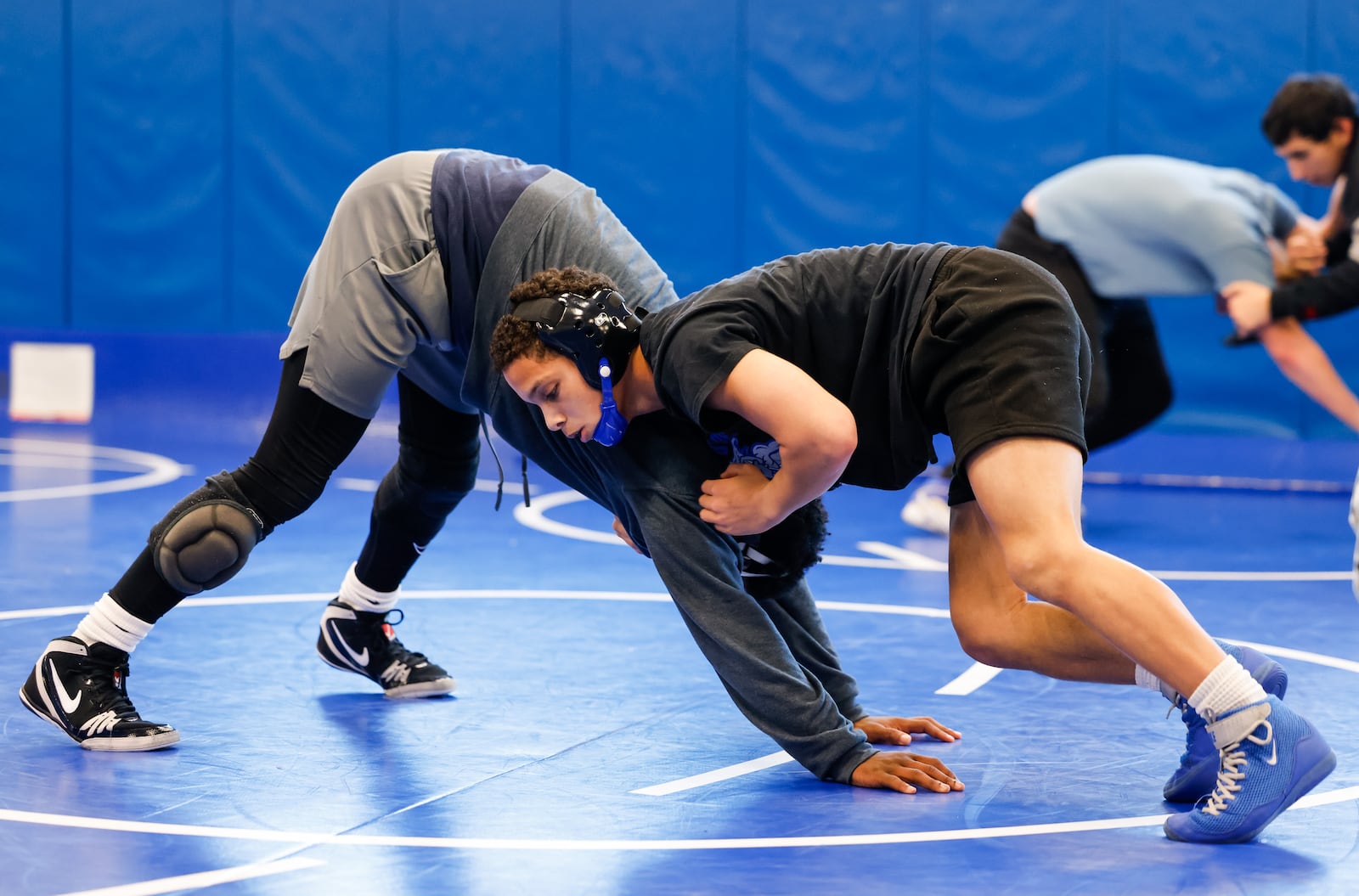 Hamilton High School senior wrestler Jayden Knowles practices with teammate Rante Wagner on the mat. Knowles recently earned the 98th win of his wrestling career. NICK GRAHAM/STAFF