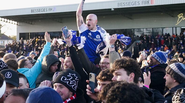 Macclesfield Town's Josh Kay celebrates with fans following the FA Cup third round soccer match between Macclesfield Town and Crystal Palace, at the Leasing.com Stadium, Macclesfield, England, Saturday, Jan. 10, 2026. (Martin Rickett/PA via AP)