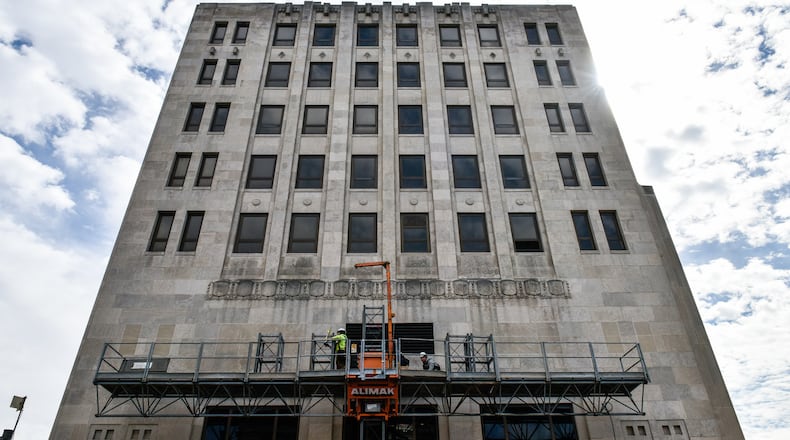 Crews were working on the exterior of the historic Goetz Tower Wednesday, March 13 in Middletown. Coon Restoration plans to transform the building into office and residential space that officials say will help that area of downtown. NICK GRAHAM/STAFF