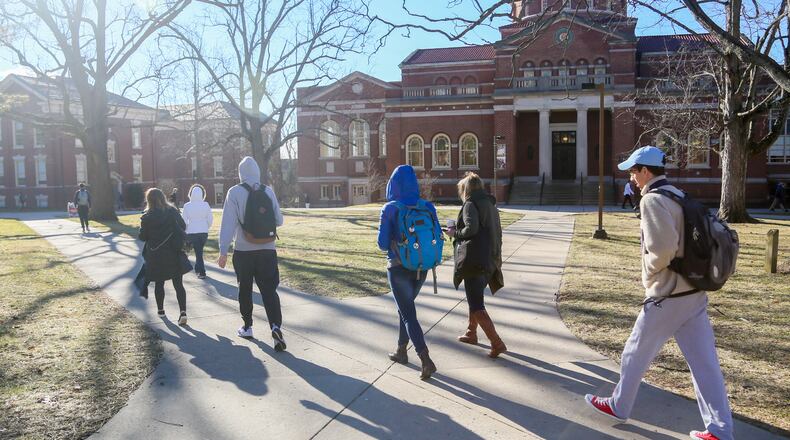Students walk through the campus of Miami University in Oxford, Wednesday, Feb. 15, 2017. Enrollment at area colleges has dropped from 1 to 4 percent, due to various reasons, including more people going back to work with the improved economy. GREG LYNCH / STAFF