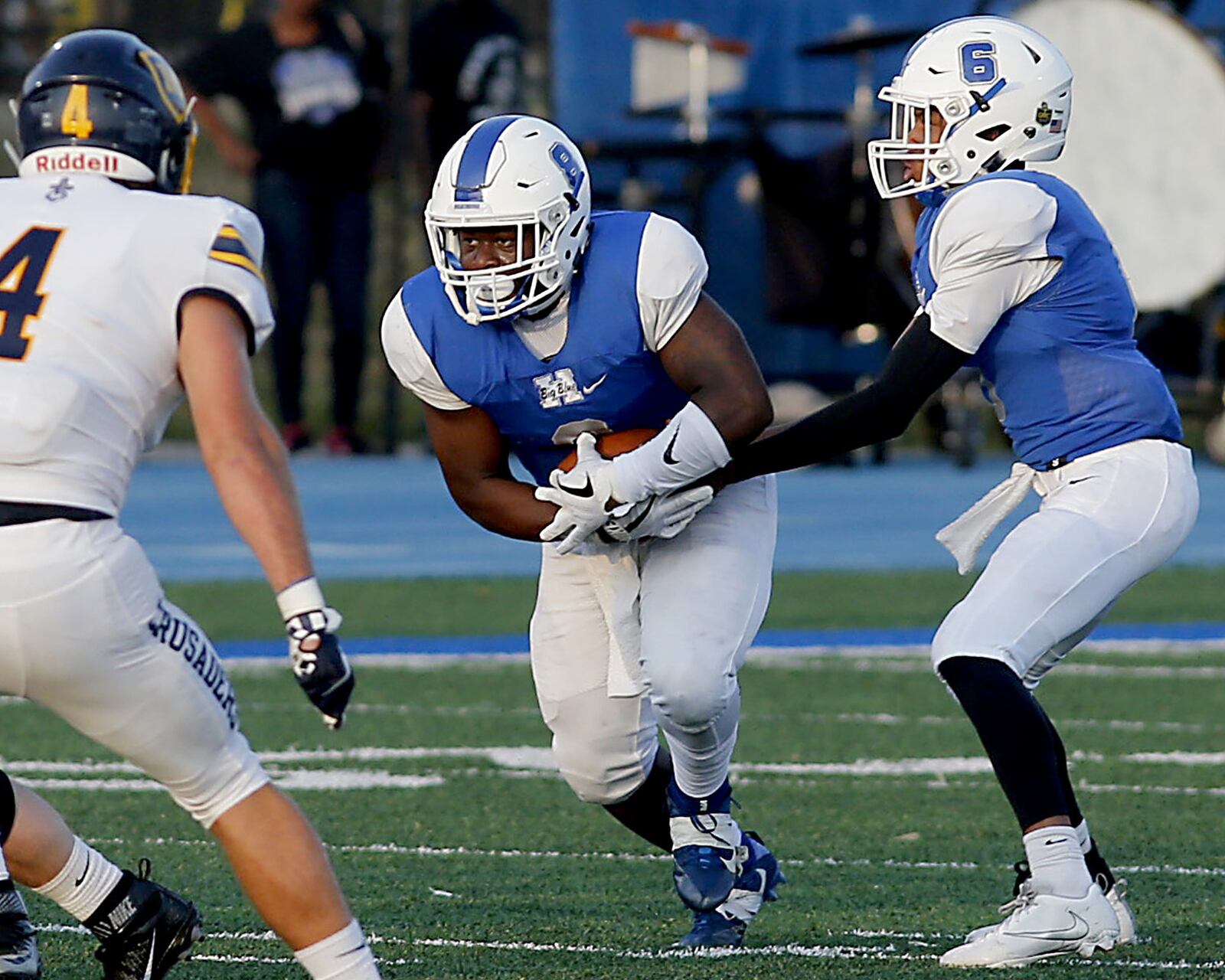 Hamilton’s Maleek Jarrett takes the ball from Khaliyal Sowell during their Skyline Chili Crosstown Showdown game against Moeller at Virgil Schwarm Stadium in Hamilton on Saturday night. CONTRIBUTED PHOTO BY E.L. HUBBARD
