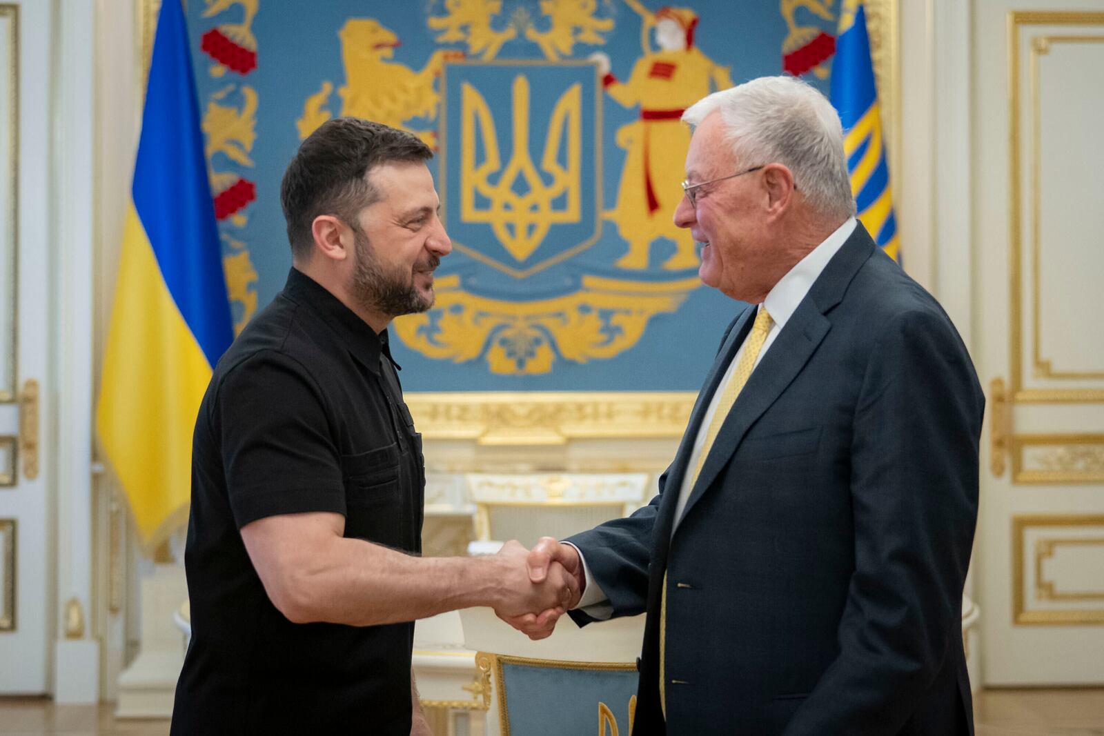 Ukrainian President Volodymyr Zelenskyy, left, shakes hands with United States Special Envoy for Ukraine and Russia, Joseph Keith Kellogg in Kyiv, Ukraine, Monday, July 14, 2025. (Ukrainian Presidential Press Office via AP)