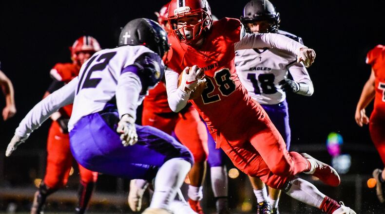 Madison’s Jake Phelps carries the ball in for a touchdown during their 50-6 win over Cincinnati Hills Christian Academy in their Division V, Region 20 football semifinal, Saturday, Nov. 10 at Lakota East High School in Liberty Township. NICK GRAHAM/STAFF
