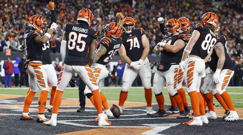 The Cincinnati Bengals celebrate a first-half touchdown against the Baltimore Ravens in a wild-card playoff game at Paycor Stadium on Jan. 15, 2023. Nick Graham/STAFF