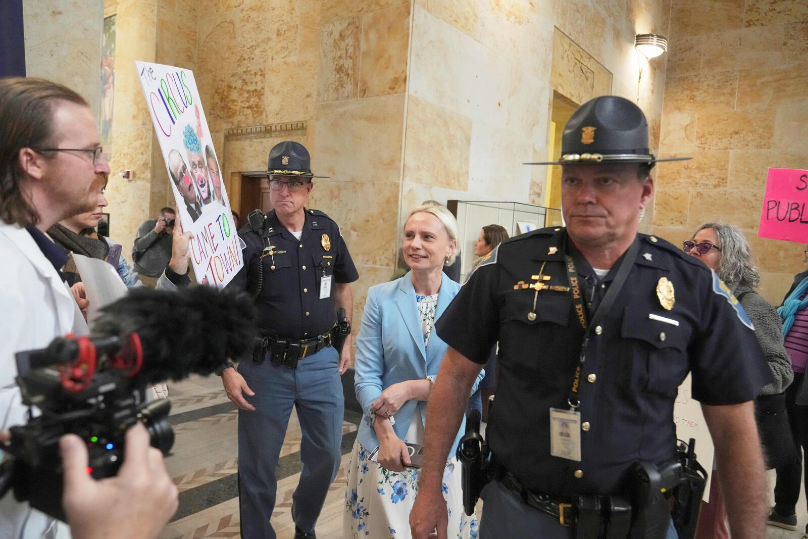 Rep. Victoria Spartz, R-Ind., is escorted out of the Make Indiana Healthy Again initiative event in Indianapolis, Tuesday, April 15, 2025. (AP Photo/Michael Conroy)