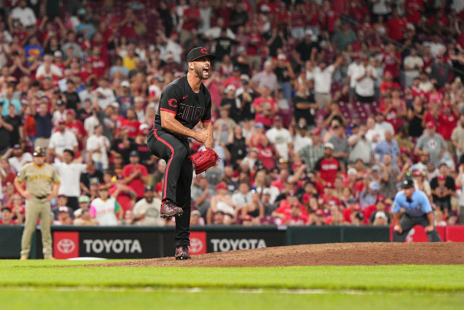Cincinnati Reds pitcher Nick Martinez reacts after striking out San Diego Padres' Jake Cronenworth to retire the side during the eighth inning of a baseball game, Friday, June 27, 2025, in Cincinnati. (AP Photo/Jeff Dean)