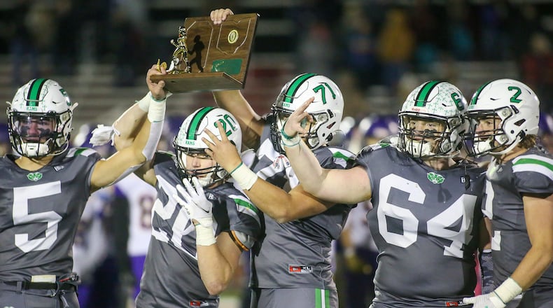 The captains of the Badin High School football team hold the trophy after beating Bellbrook 21-9 in the Division III, Region 12 final on Friday night at Trotwood Madison High School. CONTRIBUTED PHOTO BY MICHAEL COOPER