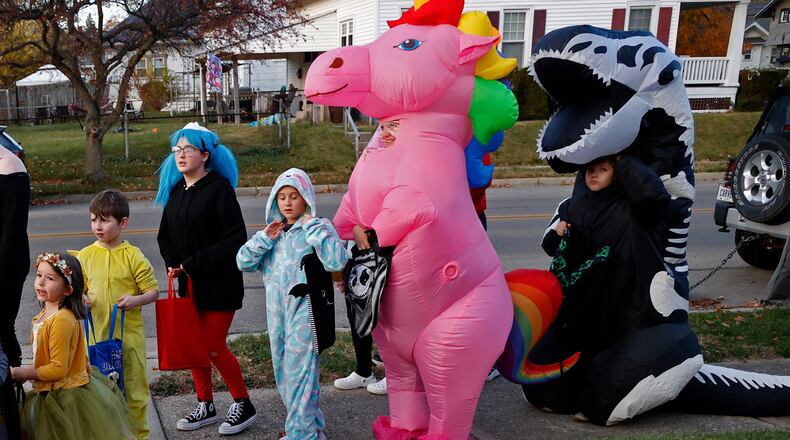 FILE PHOTO: The sidewalks in Springfield were filled with ghouls and goblins with the occasional super hero and princess thrown in for good measure Saturday night, Oct. 29, 2022 during this year's Trick or Treat in Clark County. Kids of all ages went door to door to houses, some with elaborate decorations, filling their bags with sweet treats. BILL LACKEY/STAFF