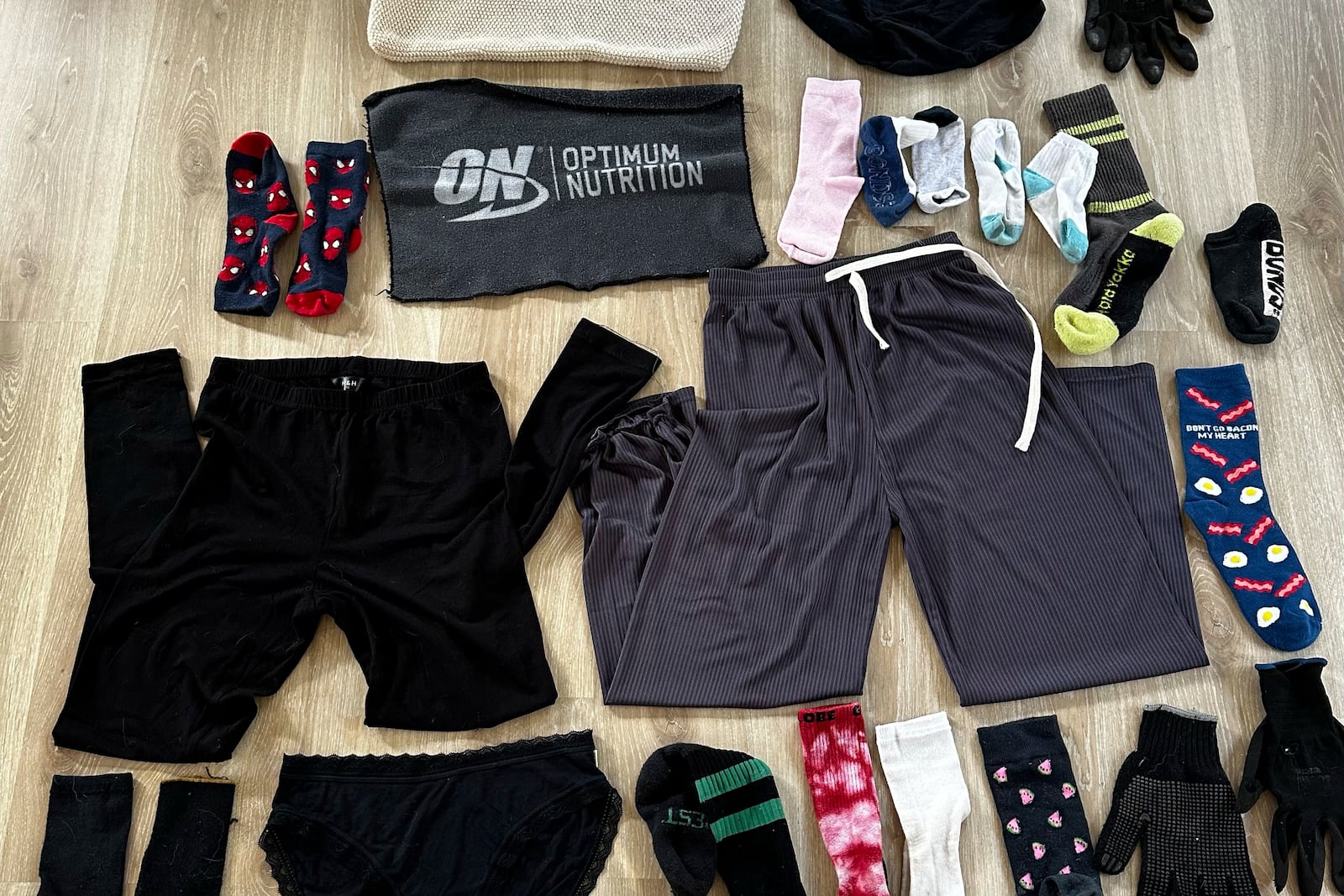 This July 20, 2025, photo provided by Helen North shows some of the things the haul Leo the laundry-stealing cat has taken in Auckland, New Zealand. (Helen North via AP)