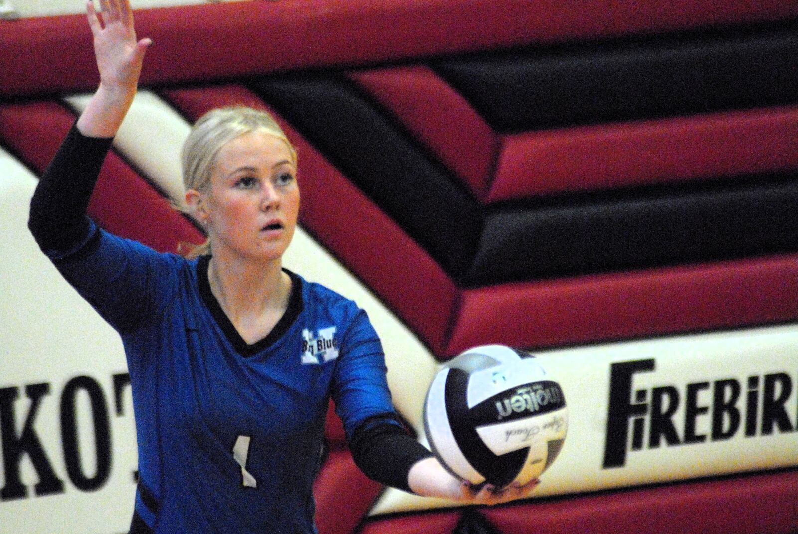 Hamilton's Emili Schappacher (1) prepares to send a serve over the net against Edgewood on Monday during a Division I sectional opener at Lakota West. Chris Vogt/CONTRIBUTED