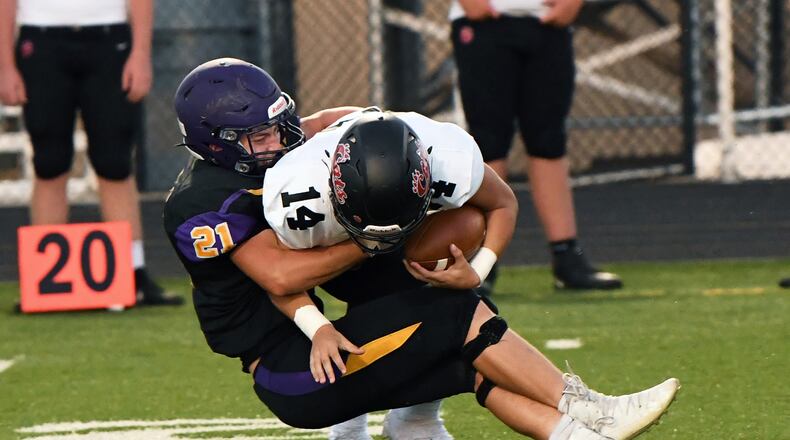 Bellbrook's Jonah Atchison tackles Franklin's Drew Isaacs during their game at Bellbrook on Friday, Sept. 4, 2020. Nick Falzerano/CONTRIBUTED