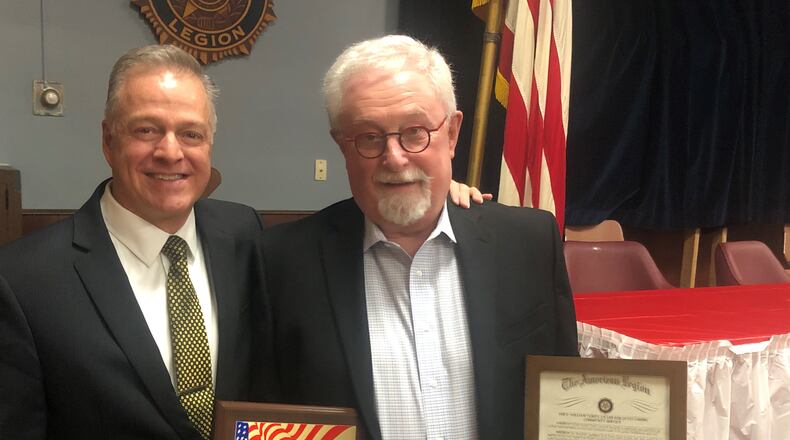 Middletown Municipal Court James Sherron, left, presented the C. William Verity Award to Sam Ashworth, former executive director of the Middletown Historical Society. RICK McCRABB/STAFF