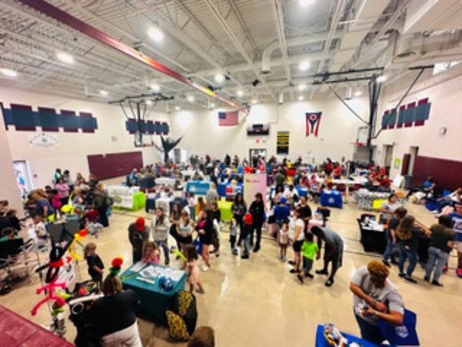 More than 300 people attended the May 4 One Village Community Day and Health Fair at the New Miami School. The event included free health screenings from Premier Health, representatives from about 30 community partners and free food. CONTRIBUTED