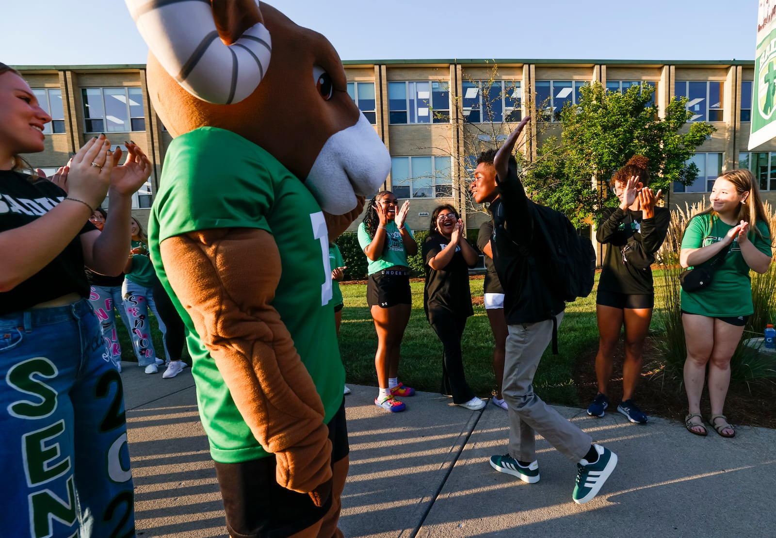 Badin freshman Liam Smith is greeted by seniors on the first day of school Tuesday, Aug. 19, 2025 at Stephen T. Badin High School in Hamilton. NICK GRAHAM/STAFF