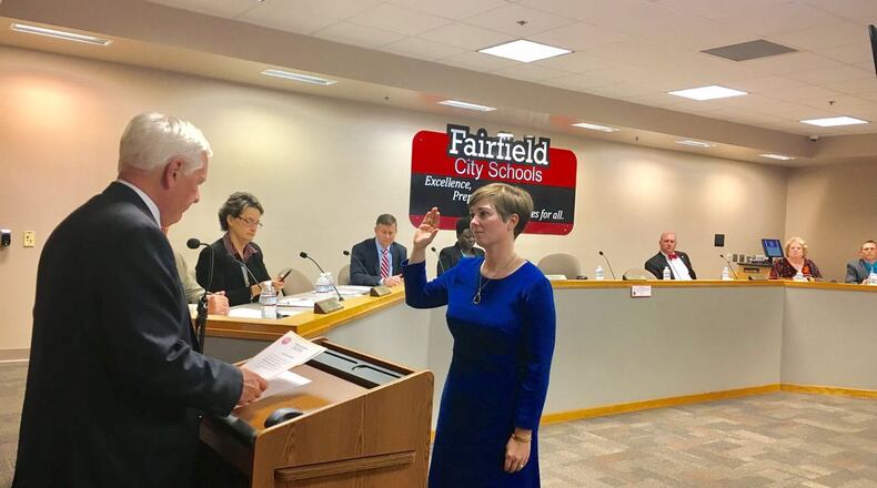 Fairfield Board of Education member Carrie O'Neal, shown here being sworn in during a 2017 meeting, has announced her resignation from the governing board overseeing the 10,000-student district. O'Neal says she plans to move outside the school system. (File Photo\Journal-News)