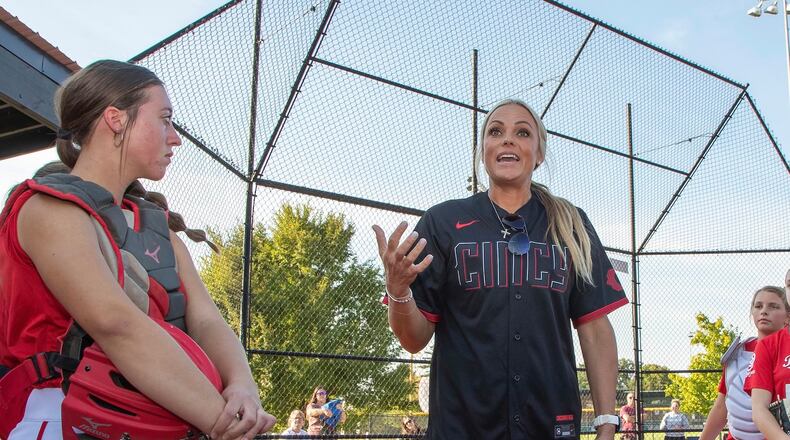 Fairfield senior Karley Clark stands with former Olympian softball pitcher Jennie Finch during a pitchers and catchers camp at the Reds RBI Youth Academy last week. CONTRIBUTED