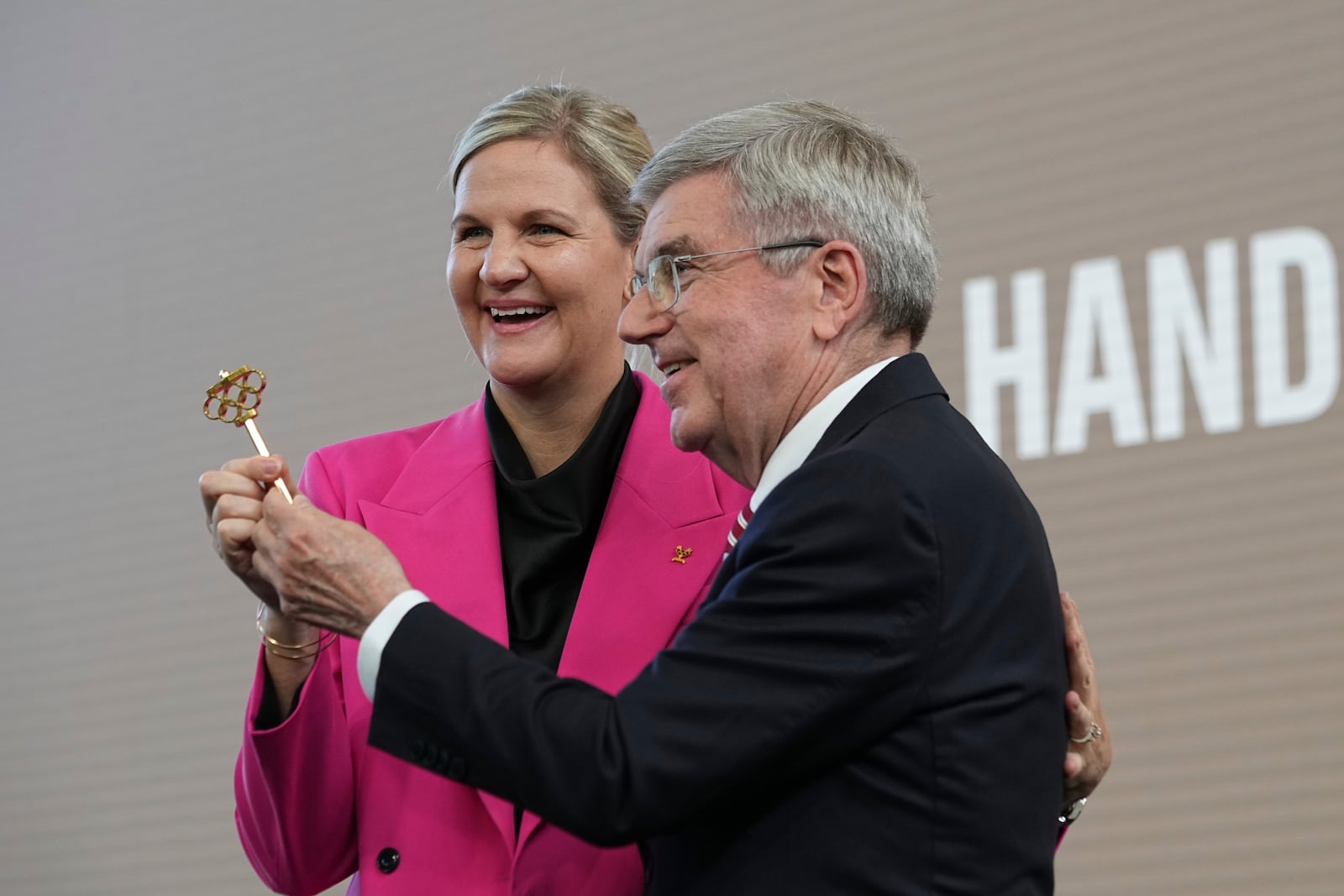 IOC President Thomas Bach, right, and President-elect Kirsty Coventry pose during the handover ceremony of the IOC Presidency at Olympic House in Lausanne, Switzerland, Monday, June 23, 2025. (AP Photo/Laurent Cipriani)